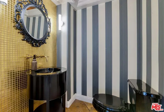 a view of a patio with a table and chairs