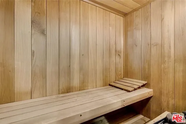 a living room with fireplace furniture and a table