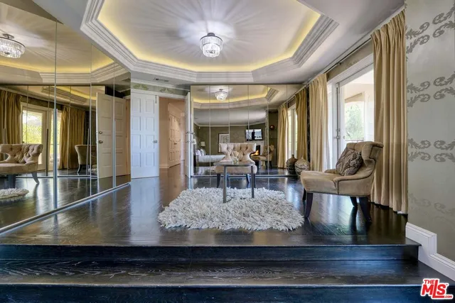 a view of walk in closet with clothes