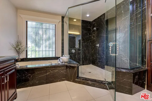 a bathroom with a sink and mirror