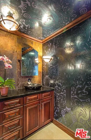 a kitchen with stainless steel appliances granite countertop a stove and a microwave