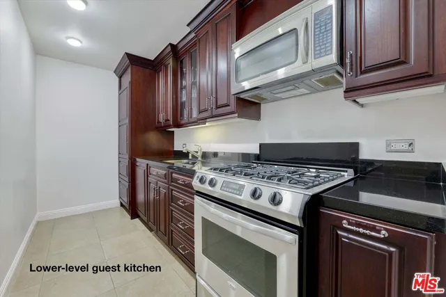 a bathroom with a double vanity sink toilet and shower
