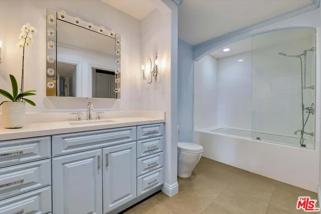 a bathroom with a tub a sink and shower