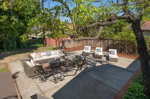 a view of outdoor sitting area with furniture
