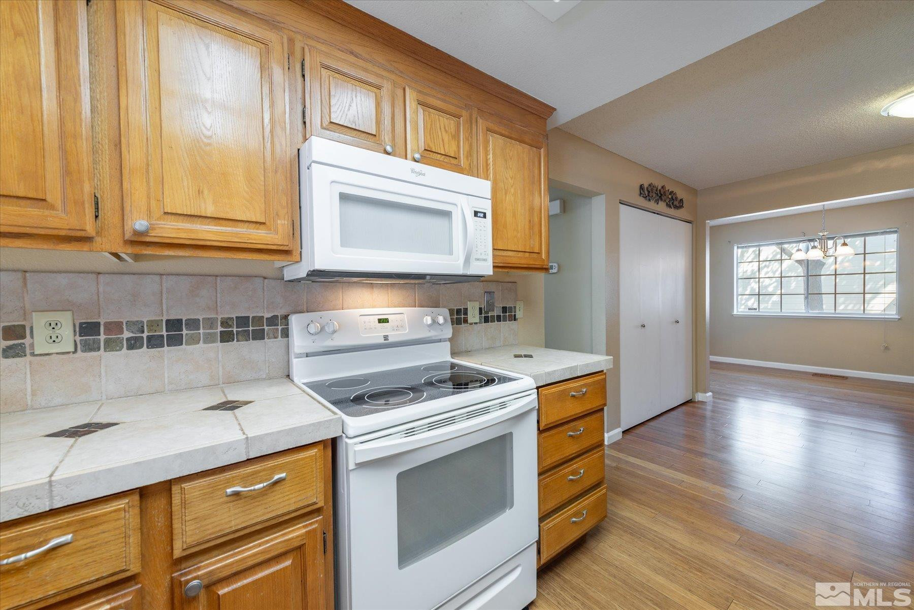 1910 Tuolumne Drive Reno, NV 89523 - Photo 13 of 36 a kitchen with stainless steel appliances granite countertop a stove and a sink