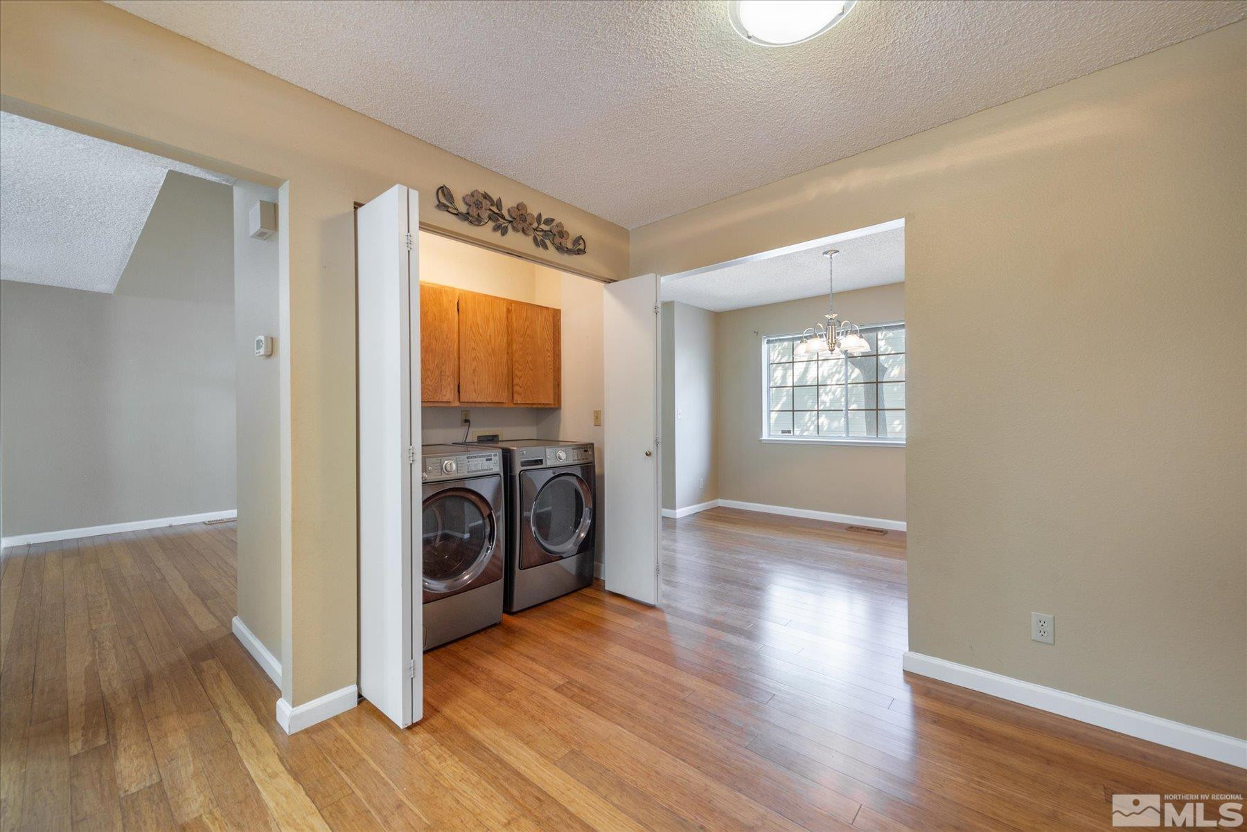1910 Tuolumne Drive Reno, NV 89523 - Photo 14 of 36 a view of a hallway with washer and dryer