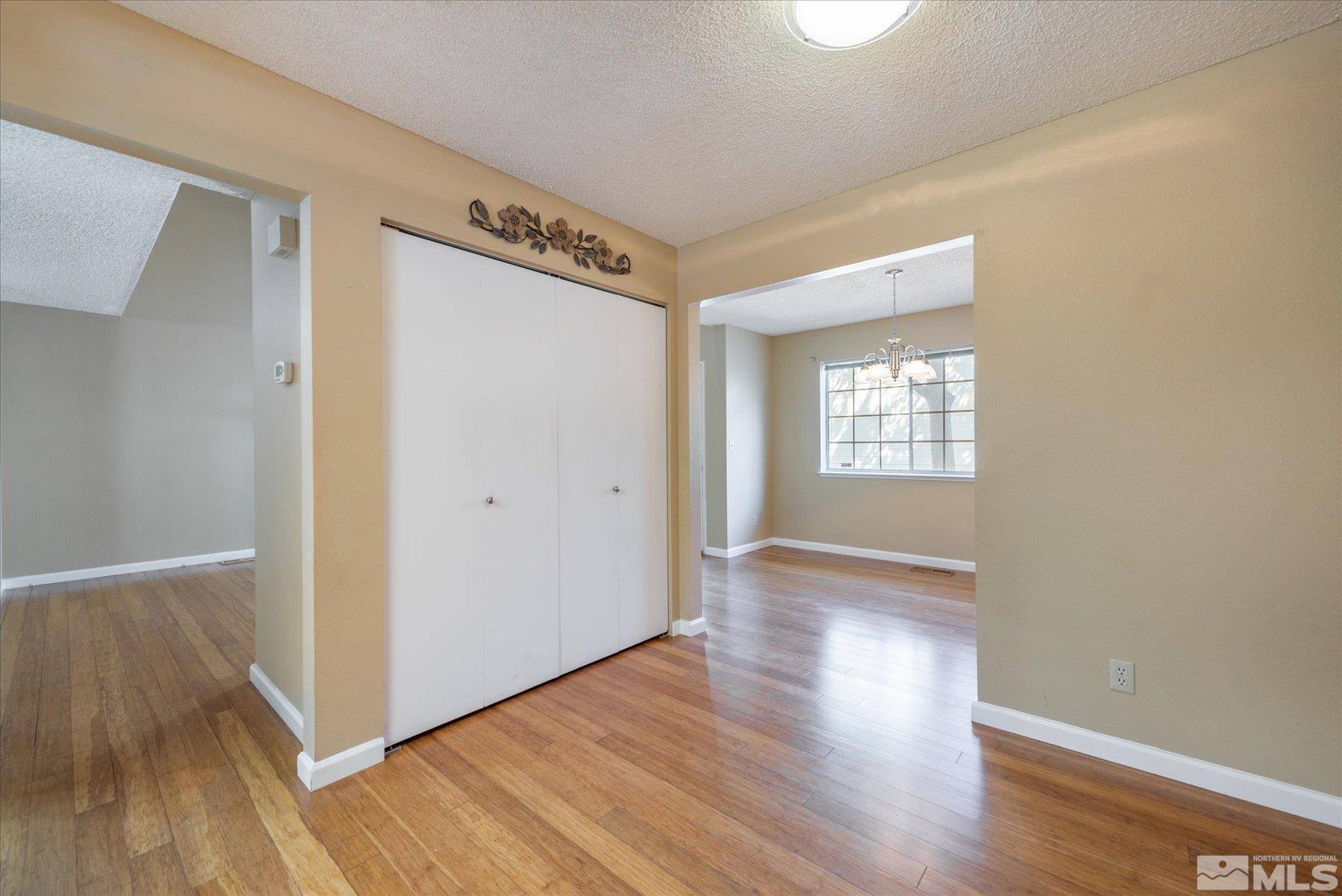 1910 Tuolumne Drive Reno, NV 89523 - Photo 15 of 36 a view of an empty room with wooden floor and a window