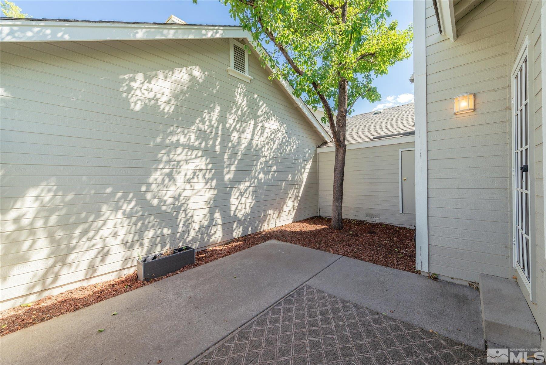 1910 Tuolumne Drive Reno, NV 89523 - Photo 19 of 36 a view of yellow house with a tree