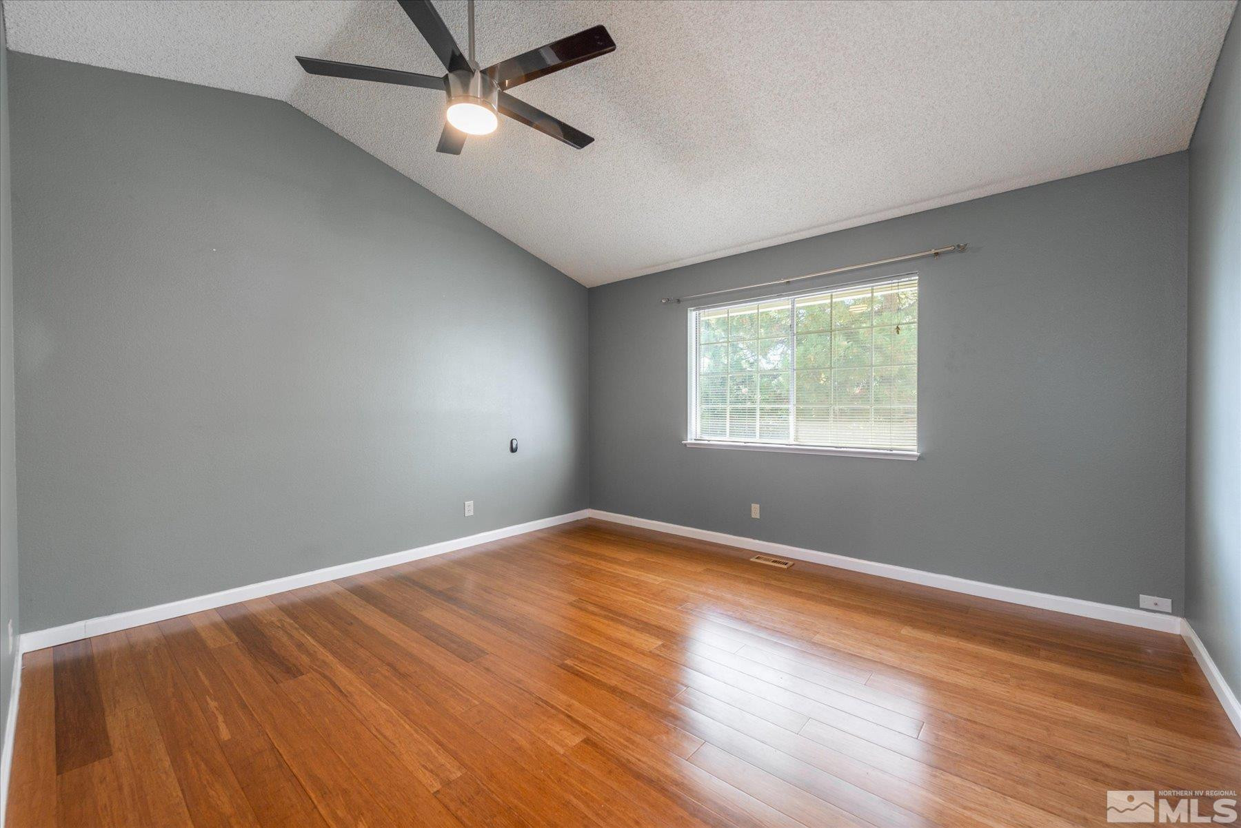 1910 Tuolumne Drive Reno, NV 89523 - Photo 26 of 36 wooden floor in an empty room with a window