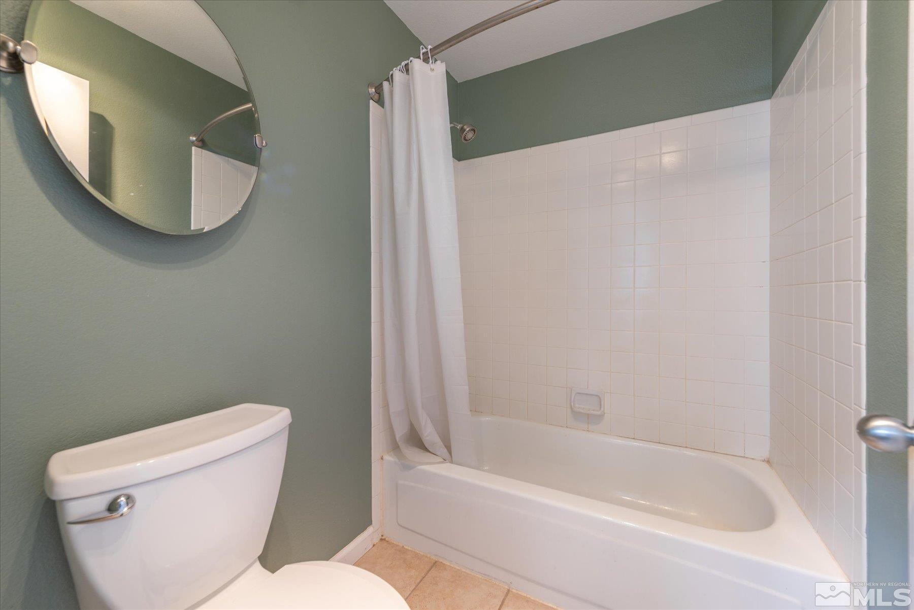 1910 Tuolumne Drive Reno, NV 89523 - Photo 28 of 36 a white toilet sitting next to a bath tub