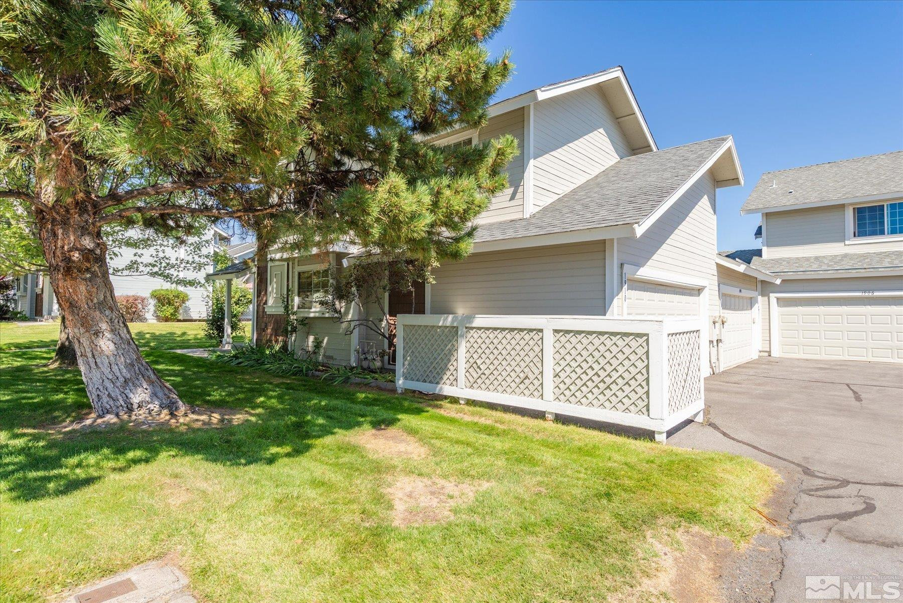 1910 Tuolumne Drive Reno, NV 89523 - Photo 35 of 36 a view of a house with a yard and garage