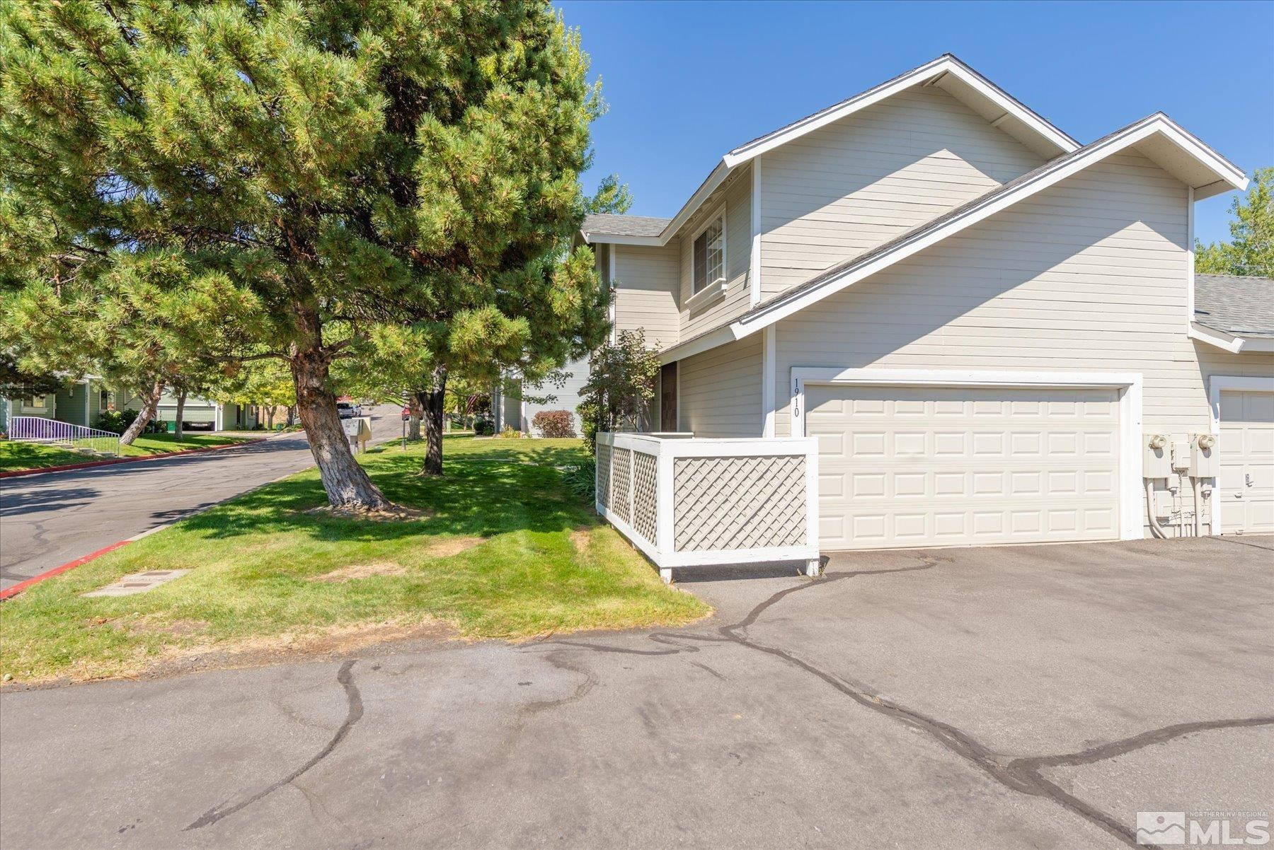 1910 Tuolumne Drive Reno, NV 89523 - Photo 36 of 36 a view of a house with backyard and a tree