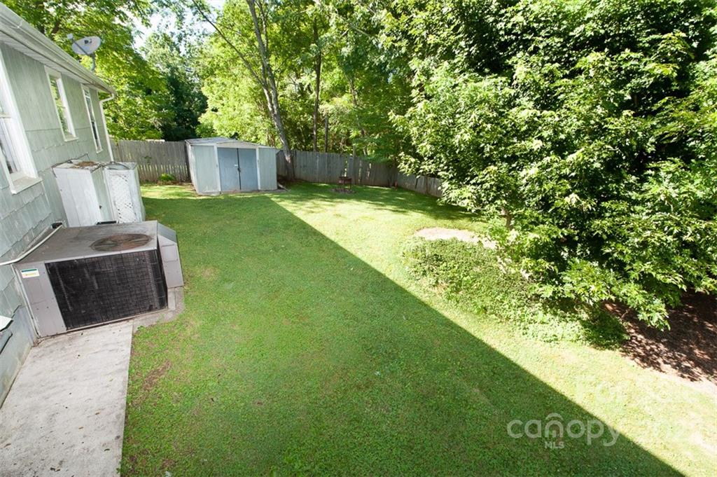 105 Smith Graveyard Road Asheville, NC 28806 - Photo 3 of 16 a view of a backyard with a small cabin
