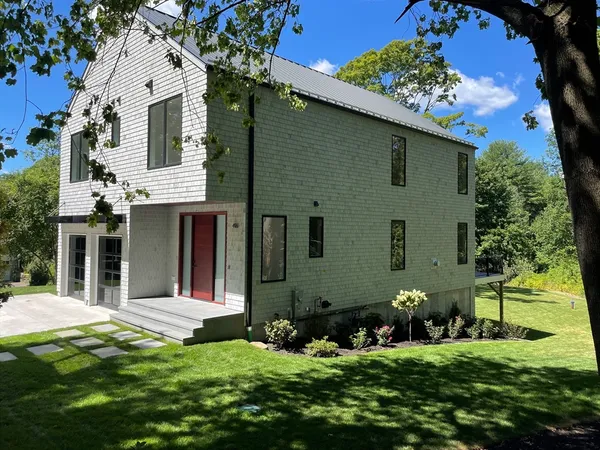 front view of a house with a yard