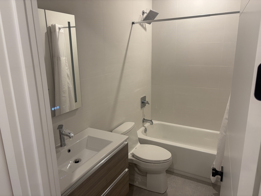 416 Conant Road Weston, MA 02493 - Photo 5 of 15 a bathroom with a sink a toilet and a bathtub