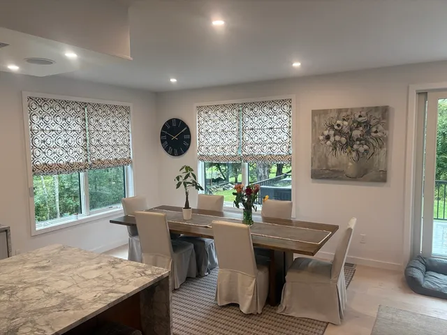 a view of a dining room with furniture window and outside view
