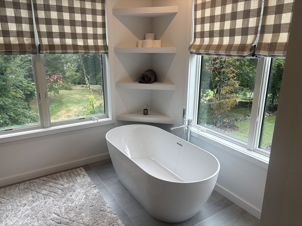 416 Conant Road Weston, MA 02493 - Photo 10 of 15 a bathroom with a bathtub and window