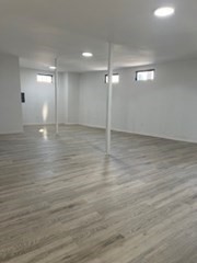 681 Millbury Street Worcester, MA 01607 - Photo 13 of 18 a view of an empty room with wooden floor