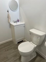 681 Millbury Street Worcester, MA 01607 - Photo 16 of 18 a bathroom with a toilet and a sink
