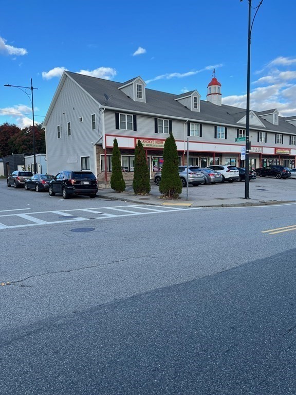 681 Millbury Street Worcester, MA 01607 - Photo 2 of 18 a view of a car park in front of house