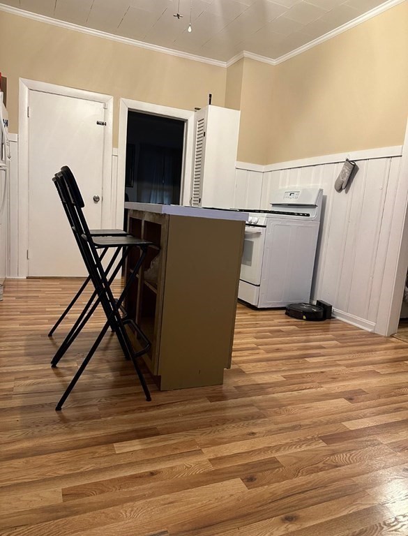681 Millbury Street Worcester, MA 01607 - Photo 7 of 18 a view of a room with wooden floor and windows