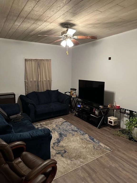 681 Millbury Street Worcester, MA 01607 - Photo 9 of 18 a living room with furniture and a flat screen tv