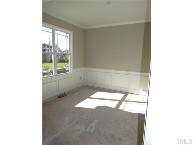 4221 Prelude Street Raleigh, NC 27616 - Photo 5 of 21 Dining room with hardwoods, beautiful moulding and chandelier