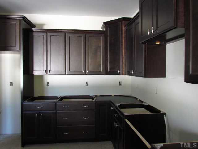 4221 Prelude Street Raleigh, NC 27616 - Photo 7 of 21 Kitchen w/ tile backsplash, granite counter tops and recessed lights