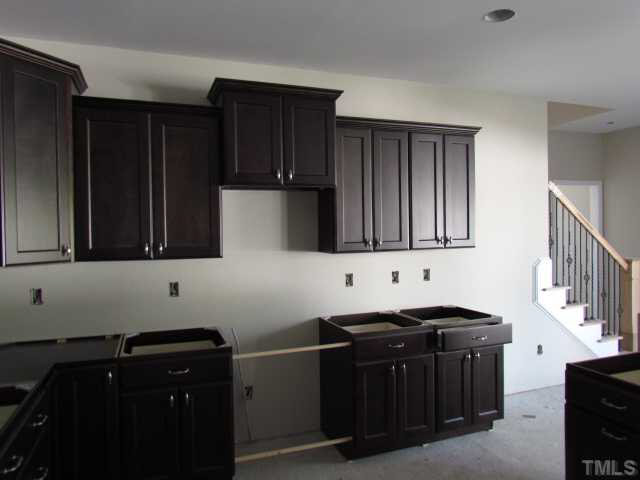 4221 Prelude Street Raleigh, NC 27616 - Photo 8 of 21 Stainless appliances include: dishwasher, electric range and microwave