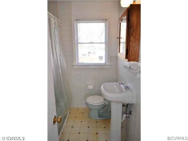 2324 Coxendale Road Chester, VA 23831 - Photo 14 of 18 a bathroom with a sink toilet and a window