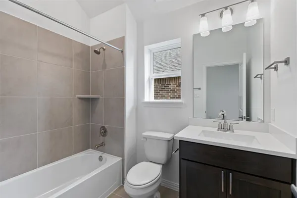 a large kitchen with stainless steel appliances granite countertop a lot of counter space and a sink