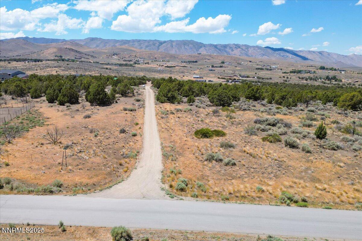 1025 Wendell Lane Reno, NV 89508 - Photo 4 of 21 a view of a yard with mountains in the background
