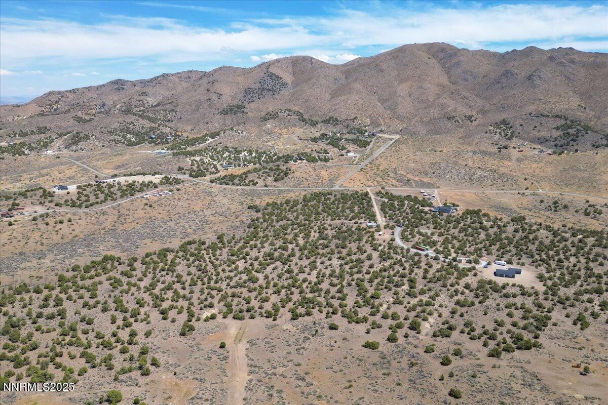 1025 Wendell Lane Reno, NV 89508 - Photo 7 of 21 a view of a dry field with mountains in the background