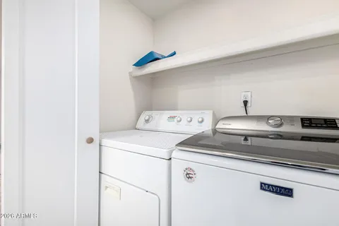 a view of a door and a window