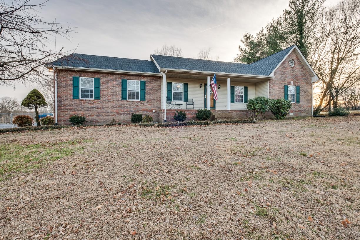 203 Link Road Cottontown, TN 37048 - Photo 1 of 30 a front view of a house with a yard