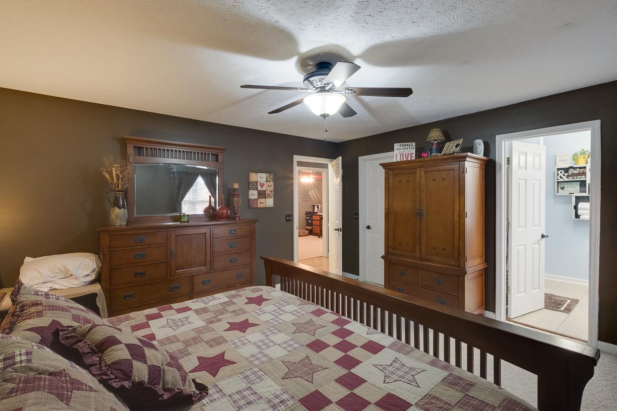 203 Link Road Cottontown, TN 37048 - Photo 12 of 30 a bedroom with a bed and a dresser with mirror
