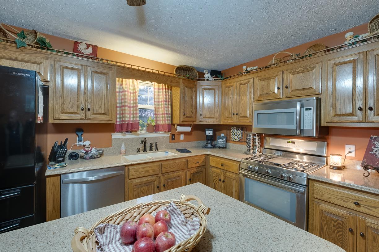 203 Link Road Cottontown, TN 37048 - Photo 17 of 30 a kitchen with a sink stove and cabinets