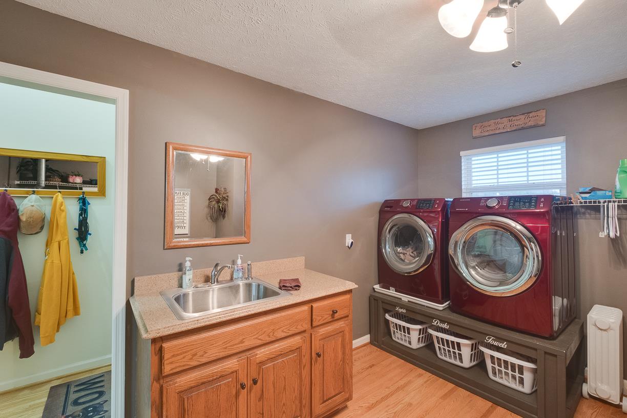 203 Link Road Cottontown, TN 37048 - Photo 21 of 30 a bathroom with a toilet a sink and a mirror