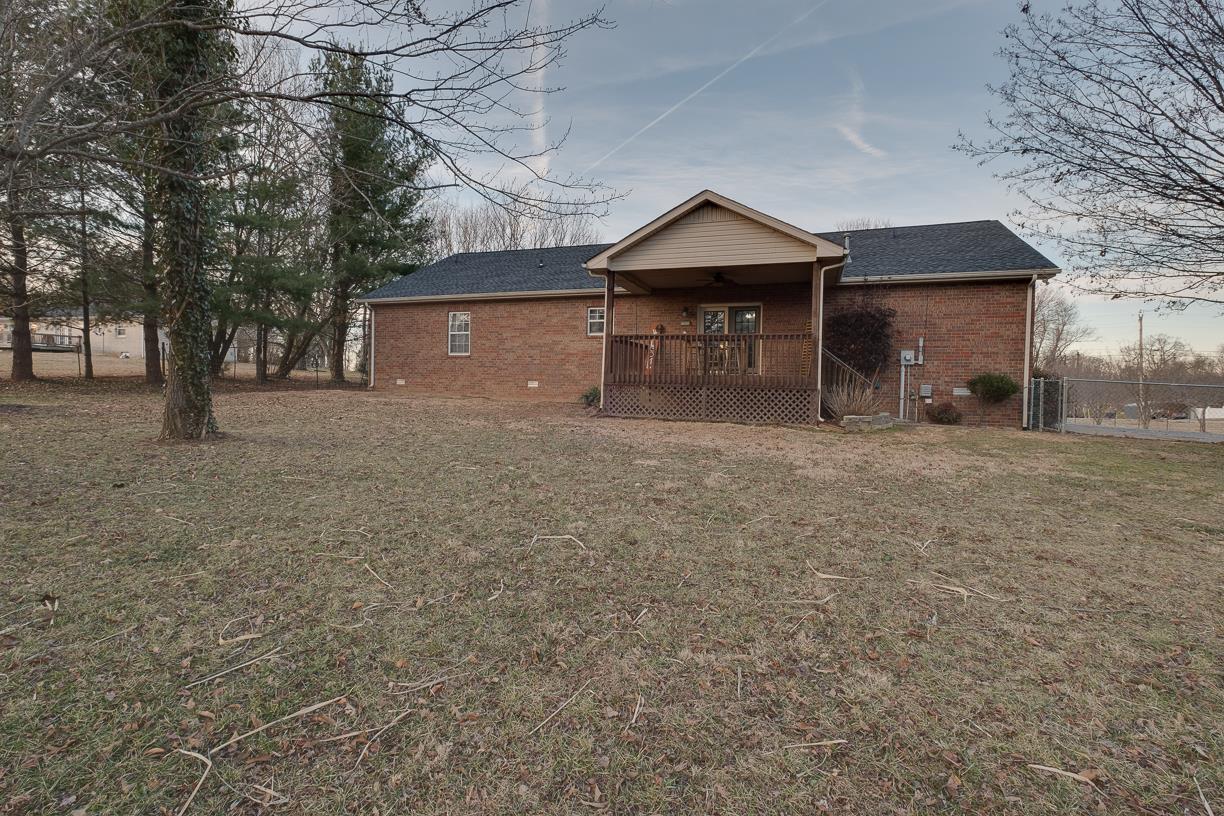 203 Link Road Cottontown, TN 37048 - Photo 25 of 30 a front view of a house with a yard and garage