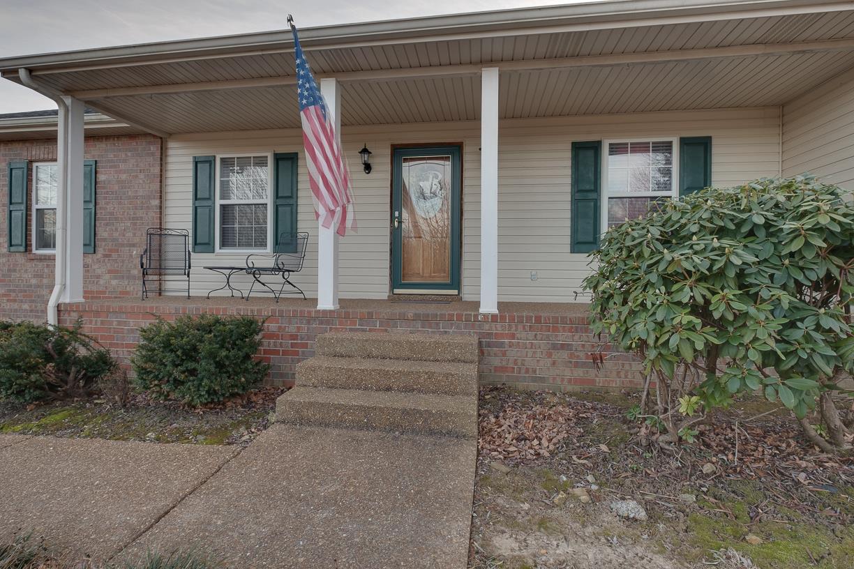203 Link Road Cottontown, TN 37048 - Photo 3 of 30 a front view of a house with garden