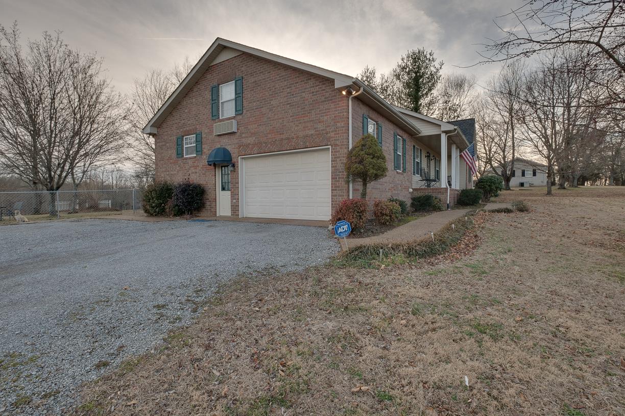 203 Link Road Cottontown, TN 37048 - Photo 4 of 30 a view of a house with a yard