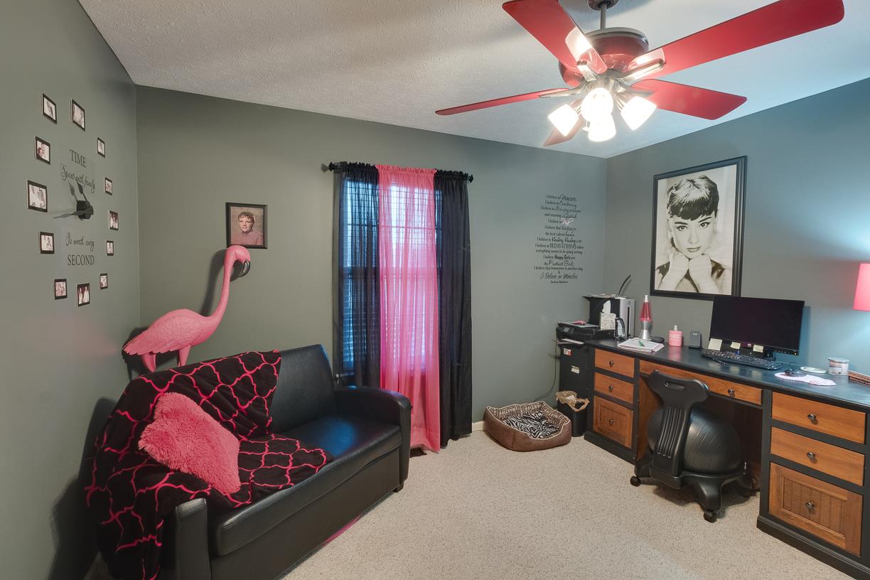 203 Link Road Cottontown, TN 37048 - Photo 9 of 30 a bedroom with furniture and a chandelier fan