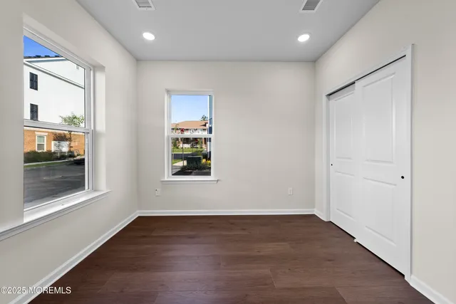 a view of a balcony with wooden floor