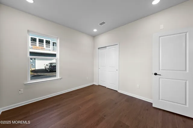 a view of a living room and kitchen with a large window