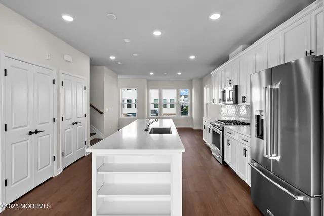 a bathroom with a double vanity sink and mirror