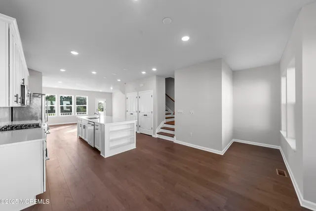 a bathroom with a double vanity sink and mirror
