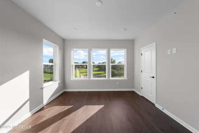 a bathroom with a granite countertop toilet a sink and a bathtub
