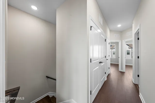a kitchen with stainless steel appliances a refrigerator and a stove top oven
