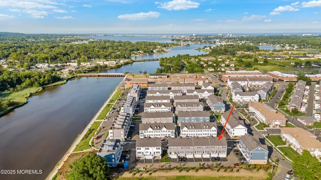 a view of staircase with railing and white walls