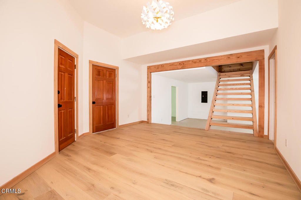 45460 Indian Shoals Road Mendocino, CA 95460 - Photo 35 of 50 a view of a livingroom with wooden floor and a ceiling fan